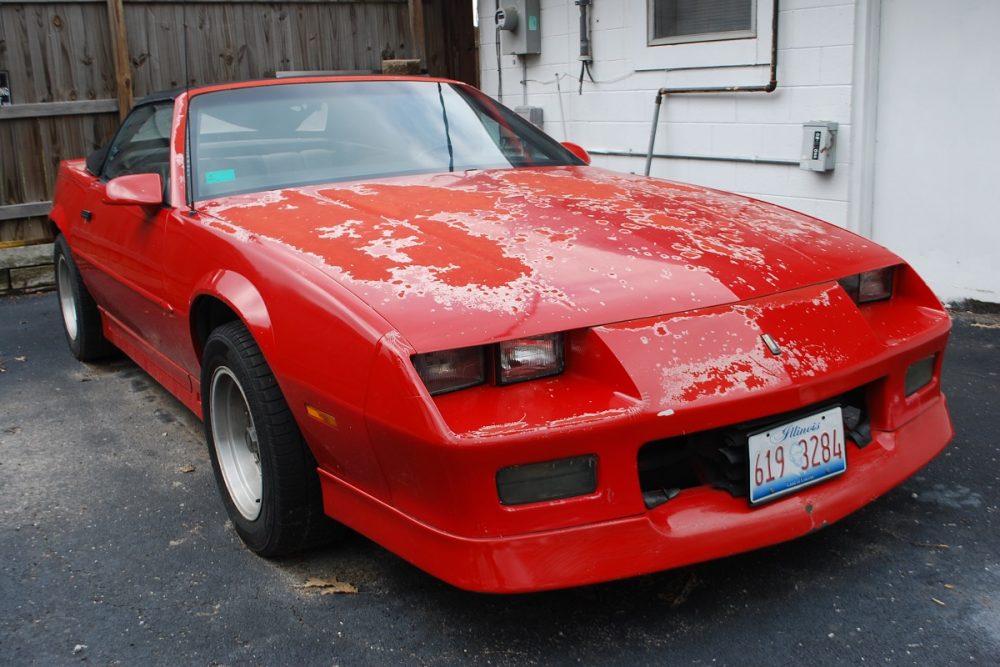 Chevrolet Camaro Convertible with cracked red paint