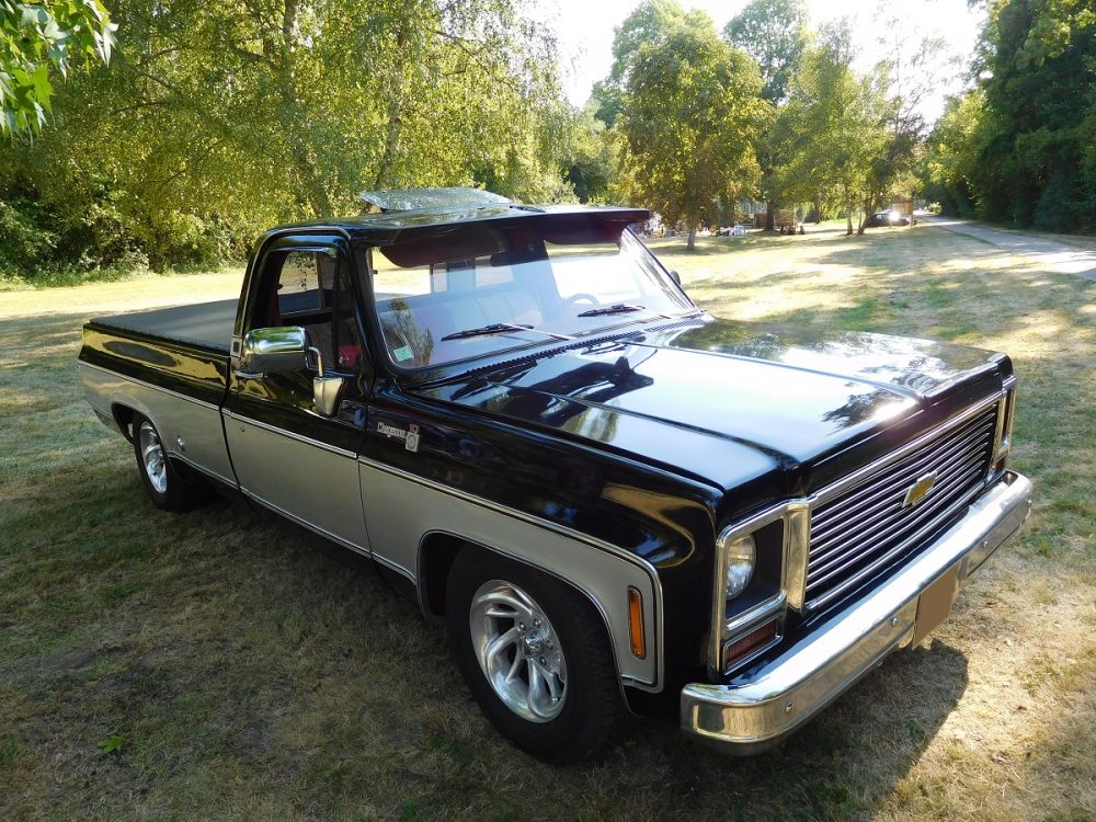 Front side view of older Chevrolet Cheyenne truck