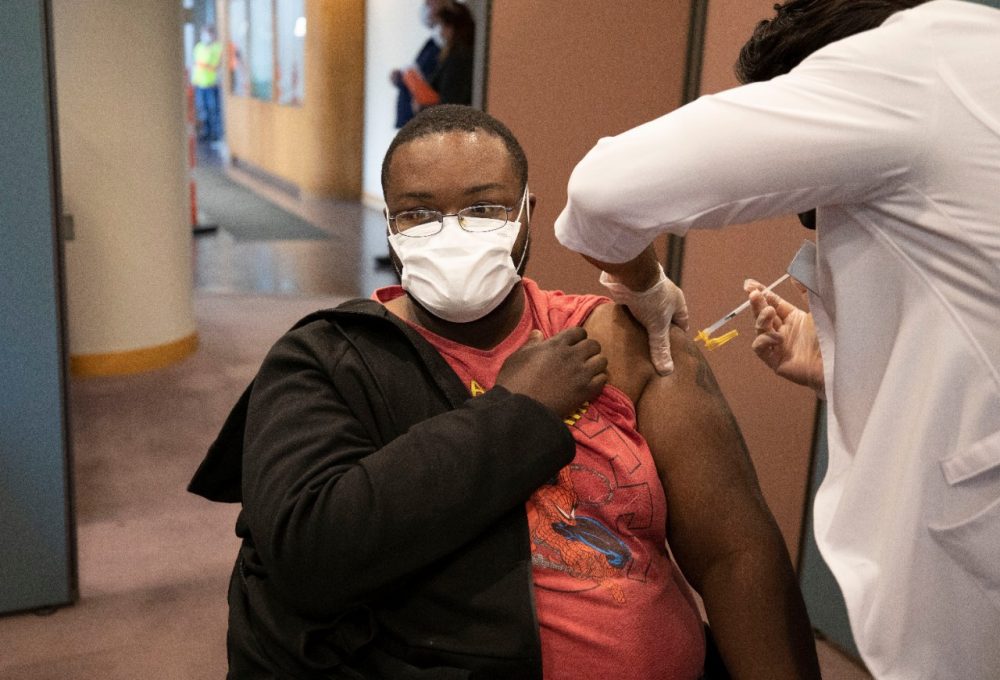 Ford Flat Rock Assembly Plant employee Karsten Colbert receives a Moderna vaccine on-site