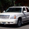 White 2005 Cadillac Escalade parked in a driveway