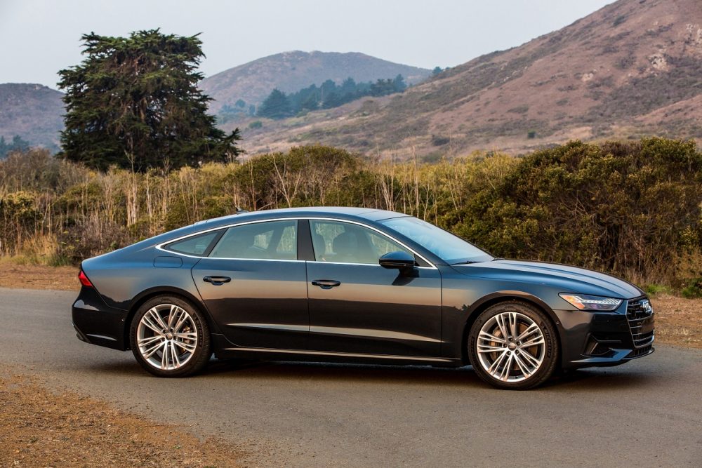 2021 Audi A7 parked on a road in front of mountains