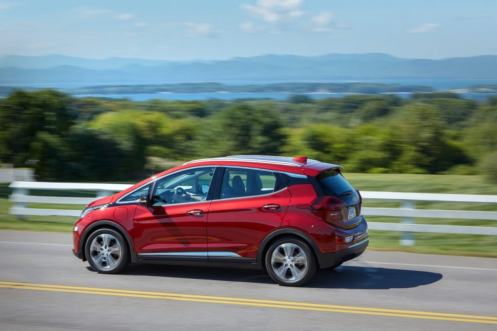 Side view of 2021 Chevrolet Bolt EV driving down road