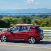 Side view of 2021 Chevrolet Bolt EV driving down road