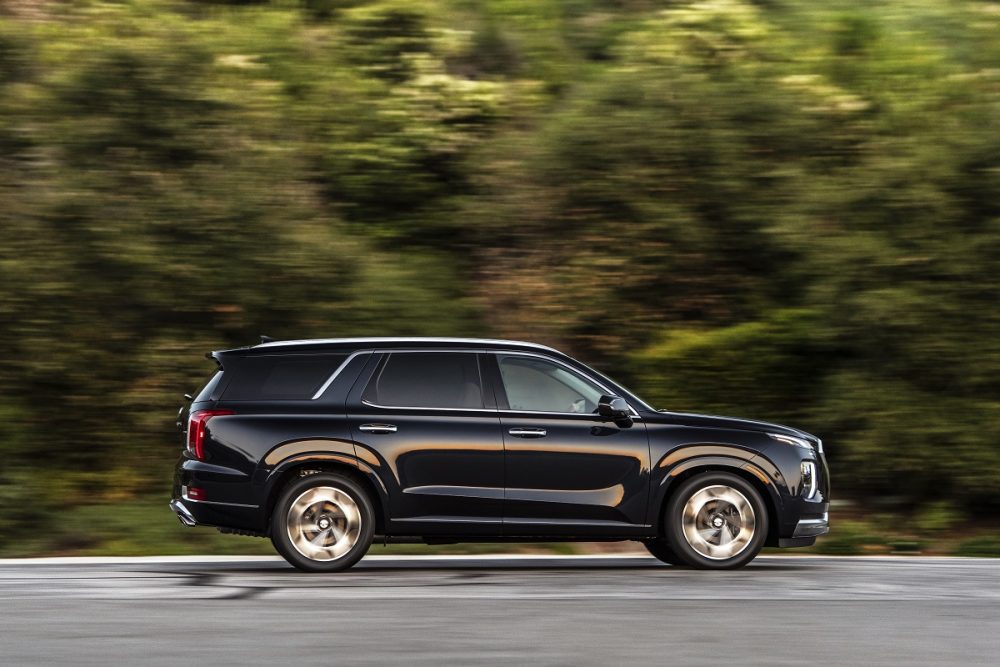 Side view of 2021 Hyundai Palisade driving down road