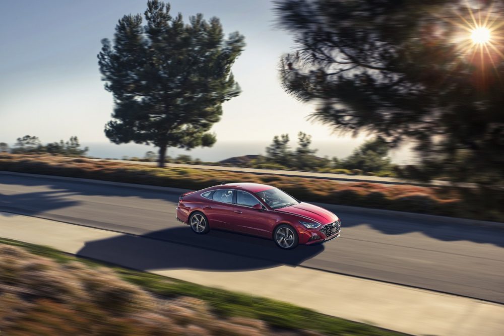 Overhead side view of 2021 Hyundai Sonata driving down road