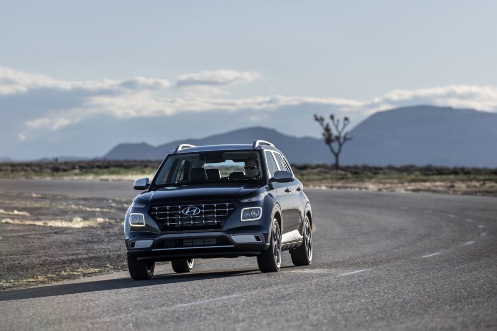 Front view of 2021 Hyundai Venue driving down road