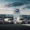 2022 Ford E-Transit fleet in front of a Ford Commercial Vehicle Center