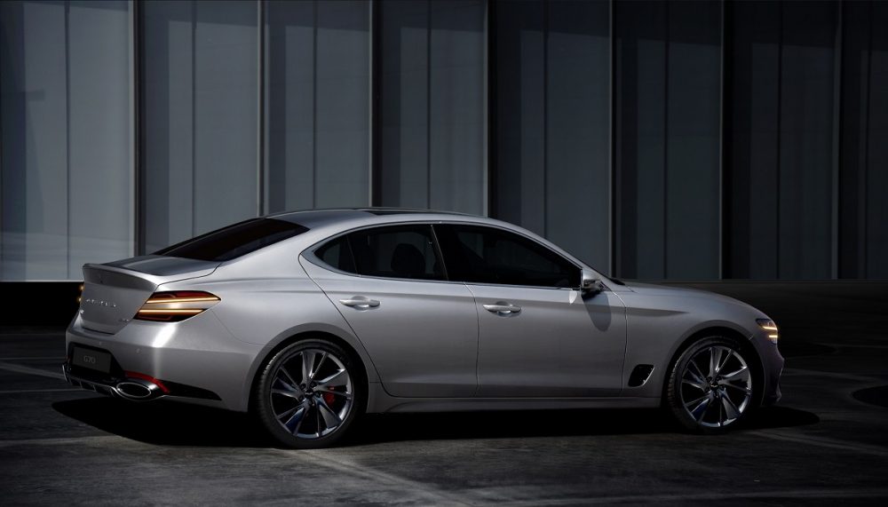 Rear side view of 2022 Genesis G70 in shadows