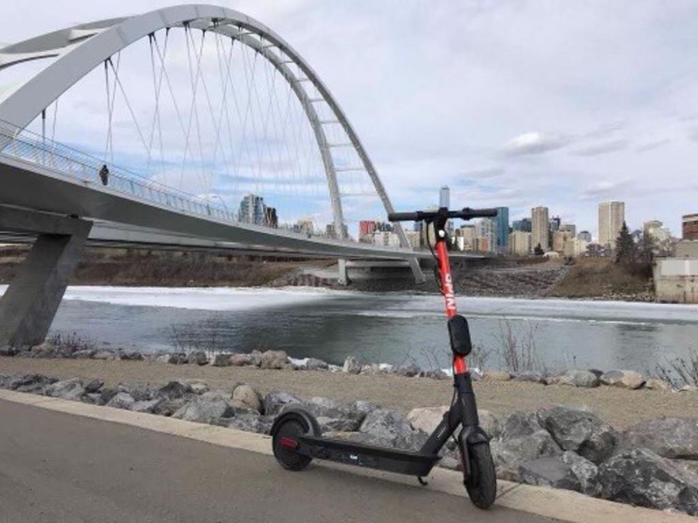 a Spin scooter by the Walterdale Bridge in Edmonton, Alberta, Canada