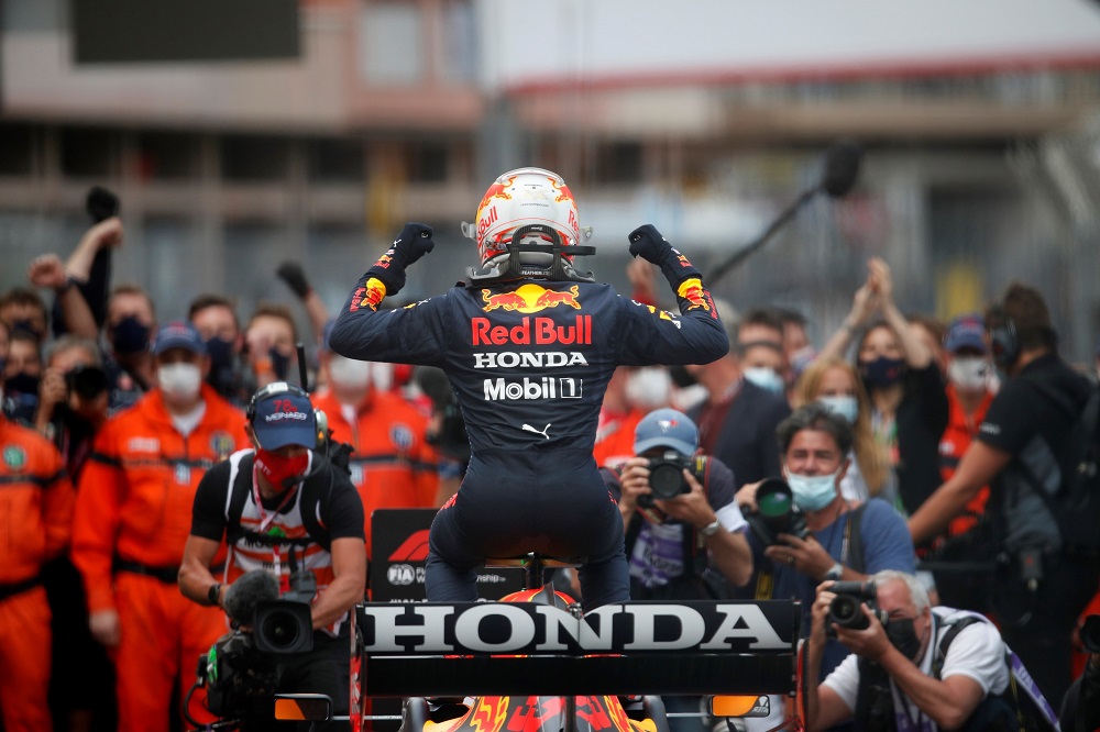 Max Verstappen flexes on his car after winning the Monaco Grand Prix