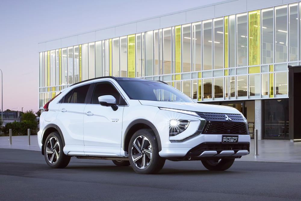 The Eclipse Cross PHEV in front of a building