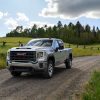 2021 GMC Sierra 2500HD driving down a country road