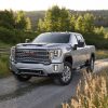 2021 GMC Sierra 2500 HD Denali driving down a country road