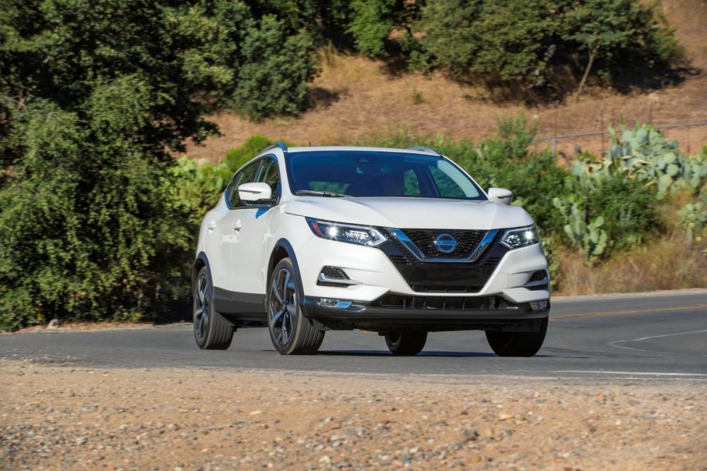 2021 Nissan Rogue Sport driving around a corner