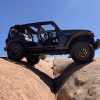 The 2021 Jeep Wrangler Rubicon 392 with the Xtreme Recon package climbing on rocks