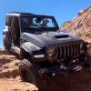 The 2021 Jeep Wrangler Rubicon 392 with the Xtreme Recon package driving on rocks