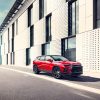 The Front side view of red 2022 Chevrolet Blazer RS parked on street