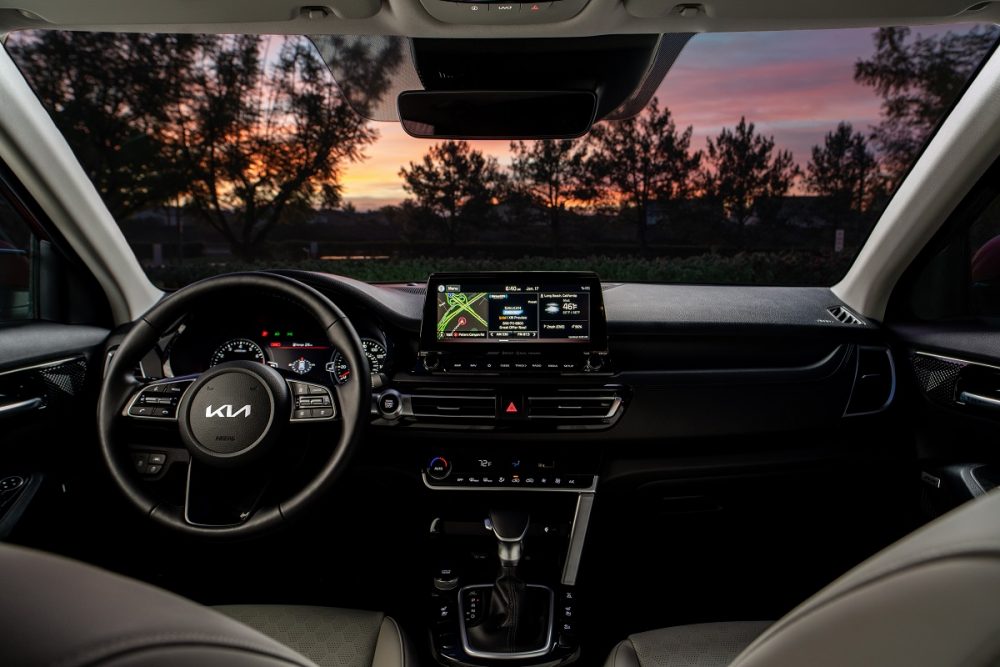 Nighttime photo of 2022 Kia Seltos SX Turbo interior dashboard and steering wheel