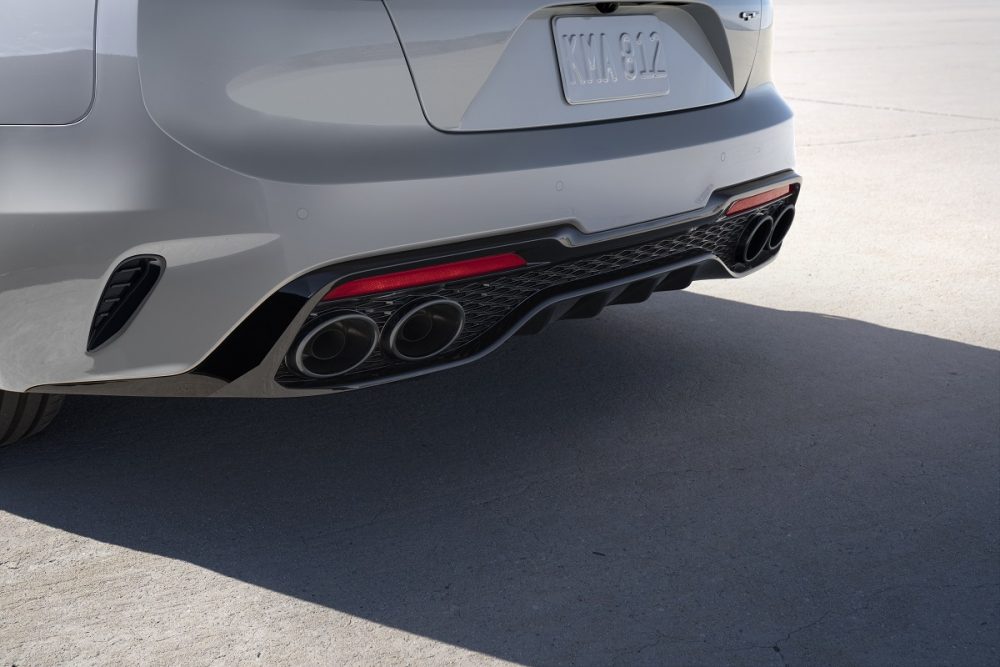 Close up view of darkened quad exhaust on the 2022 Kia Stinger Scorpion Special Edition in Ceramic Silver