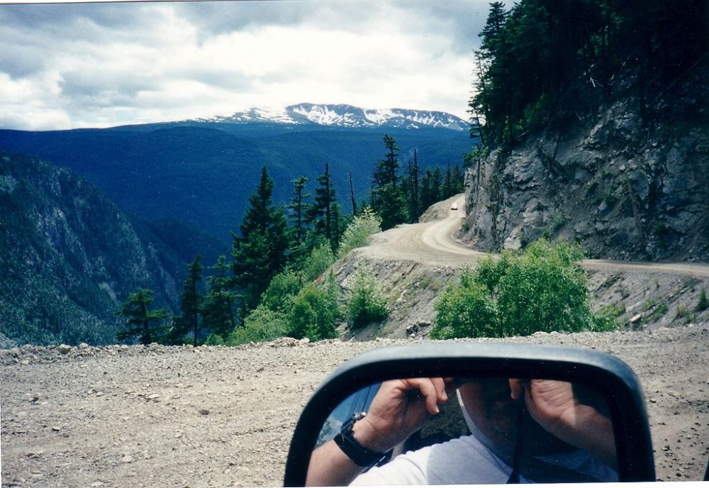 "The Hill" winding through Bella Coola with mountains behind it