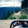 "The Hill" winding through Bella Coola with mountains behind it