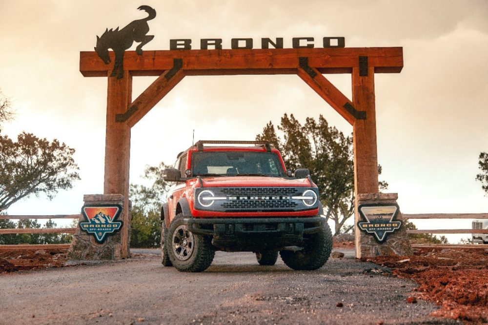 A Ford Bronco sitting under the entrance gate to the Bronco Off-Roadeo in Horseshoe Bay outside of Austin, Texas