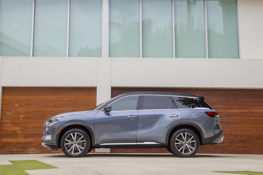 2022 INFINITI QX60 in front t of wooden garage doors