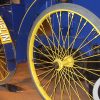 Close up of historic blue and yellow Michelin L'Eclair vehicle with pneumatic tires