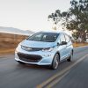 The 2017 Chevrolet Bolt EV driving down the street