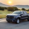 Front side view of 2021 Chevrolet Silverado 1500 RST driving down road