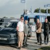 Representatives from Ford and Guinness World Records commemorate the Mustang Mach-E setting a record for least energy consumed by an electric vehicle