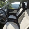 Side view of 2022 Buick Encore front seats and steering wheel