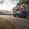 Rear side view of 2022 Chevrolet Equinox Premier driving down road