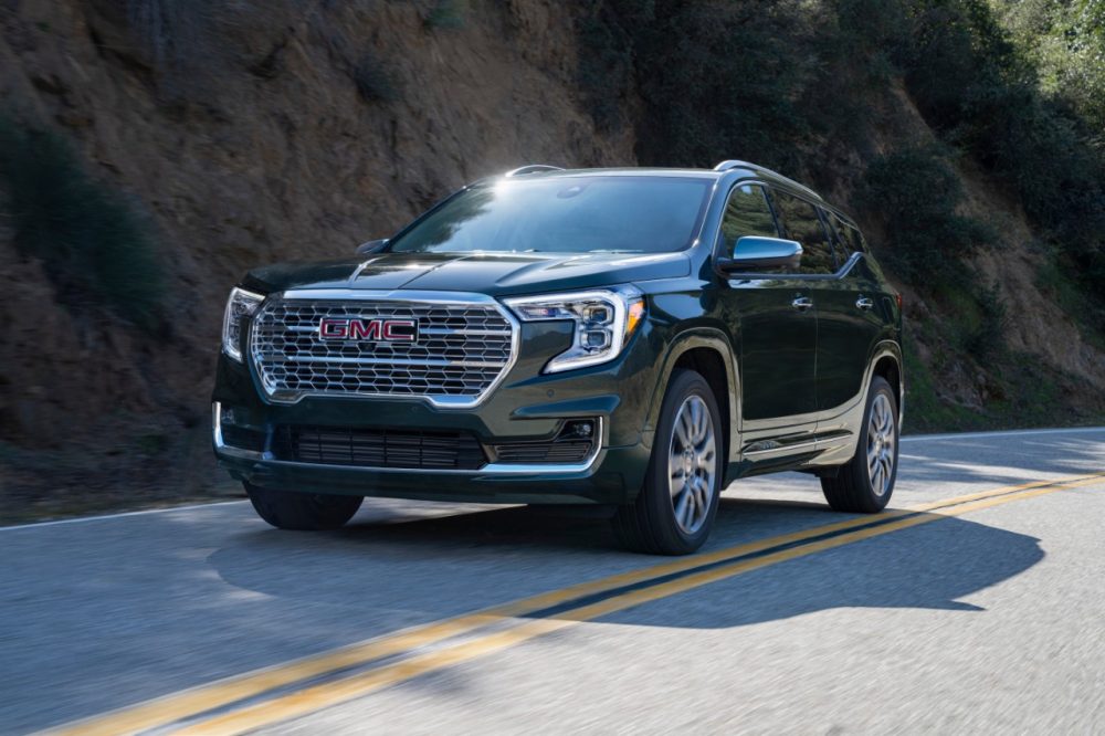 2022 GMC Terrain Denali driving alongside a mountain