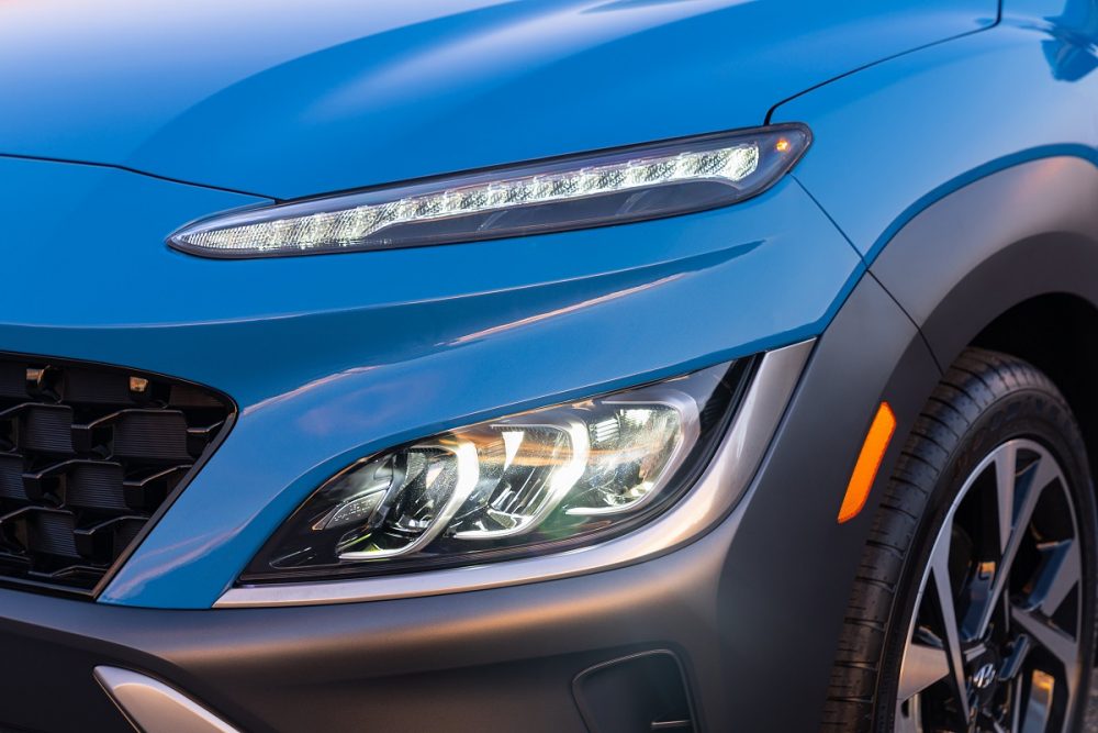 Close-up view of 2022 Hyundai Kona Limited headlights and daytime running lights