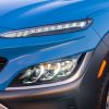 Close-up view of 2022 Hyundai Kona Limited headlights and daytime running lights