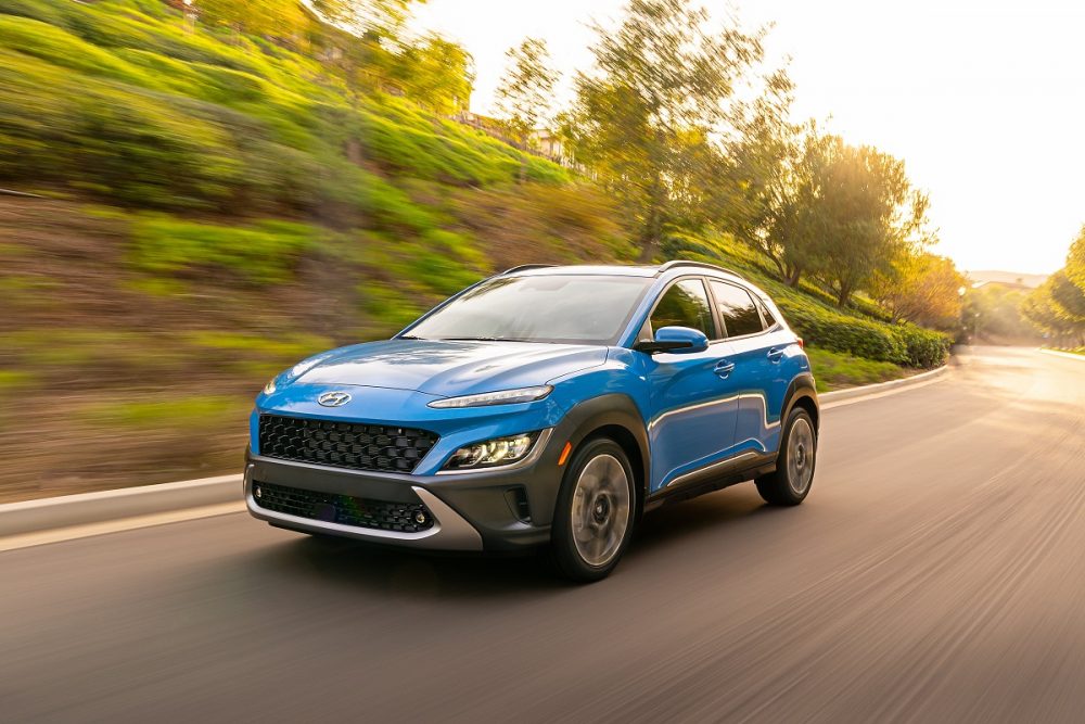 Front side view of 2022 Hyundai Kona Limited driving down road