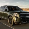 Exterior front photo of 2022 Kia Telluride driving on a desert highway