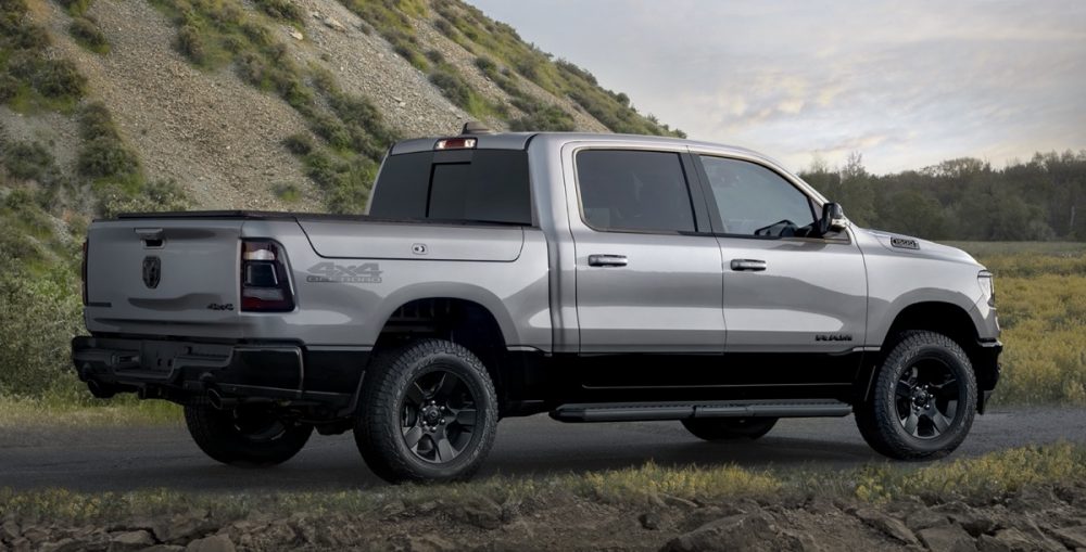 The rear of the 2022 Ram 1500 BackCountry Edition in front of a hill