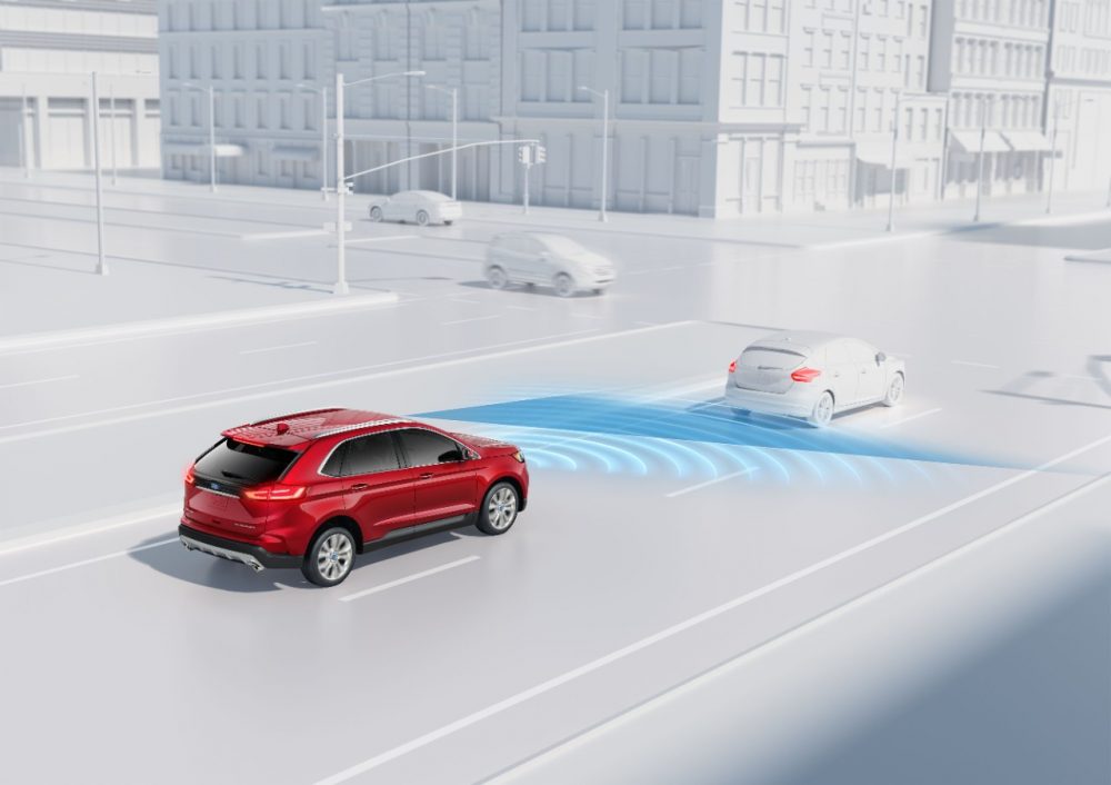 A graphic depicting a red Ford Edge demonstrating the Automatic Emergency Braking with Pre-Collision Assist feature offered in Ford Co-Pilot360