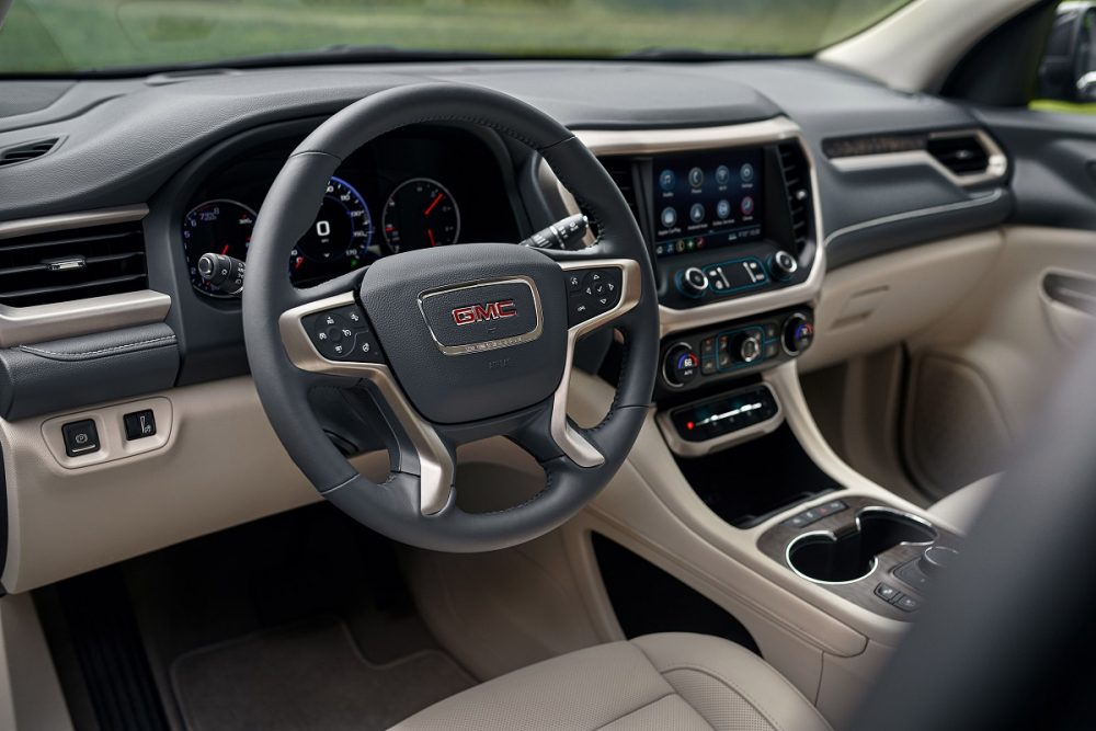 The GMC Acadia Denali steering wheel, dashboard, and console