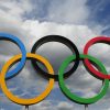 Olympic rings with cloudy sky background