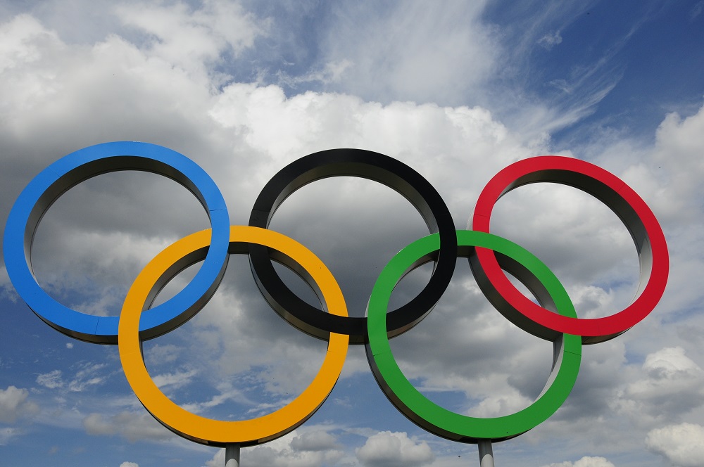 Olympic rings with cloudy sky background