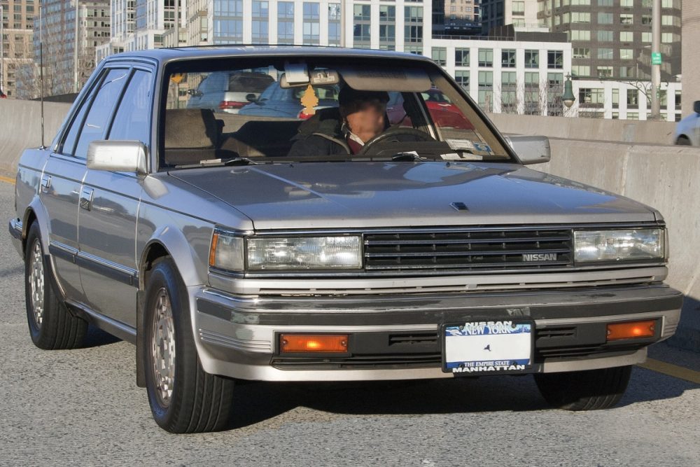 A mid-1980s Nissan Maxima being driven in New York