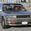 A mid-1980s Nissan Maxima being driven in New York