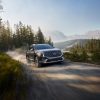 Front side view of 2021 Hyundai Santa Fe Hybrid driving on dusty road