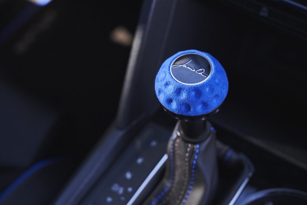 Close up of the dimpled Kingfisher Blue shift knob with Jamie Orr's engraved signature in the 2021 Volkswagen Atlas Cross Sport GT concept