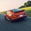 back view of a red 2022 Cadillac CT4-V Blackwing on road