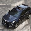 Aerial view of a dark blue 2022 Cadillac XT5 with its sunroof open