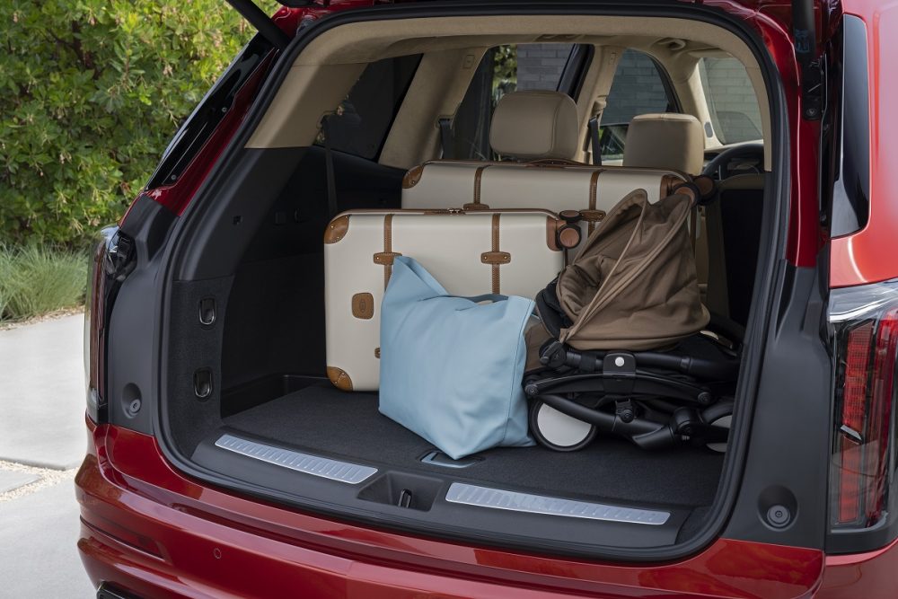 Cargo area of the 2022 Cadillac XT6 with luggage, bags, and a stroller inside